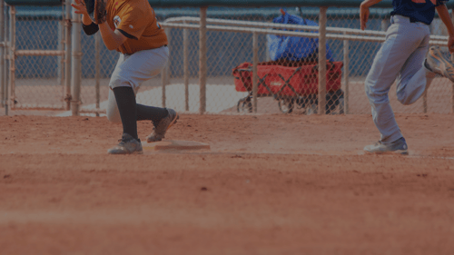 Two young boys playing baseball